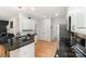 Modern kitchen with granite countertops and stainless steel appliances offers ample counter space at 11624 Crossroads Pl, Concord, NC 28025