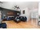 Inviting living room featuring hardwood floors, staircase, and stylish decor at 11624 Crossroads Pl, Concord, NC 28025