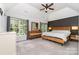 Spacious bedroom features vaulted ceiling, large windows, and stylish furnishings at 11624 Crossroads Pl, Concord, NC 28025