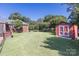 Large, well-maintained backyard featuring a storage shed and partial view of the brick home at 1280 Queensgate St, Gastonia, NC 28054