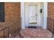 Inviting front entryway featuring a decorative tiled landing and stylish glass door at 1280 Queensgate St, Gastonia, NC 28054