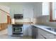 Bright kitchen features stainless steel appliances, granite countertops and white cabinetry at 1280 Queensgate St, Gastonia, NC 28054