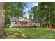 Expansive backyard with lush lawn and mature trees, offering privacy and space for outdoor activities at 1313 Western Hills Ln, Vale, NC 28168