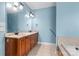 Bathroom with double sinks, granite counters, and a tile floor at 1313 Western Hills Ln, Vale, NC 28168