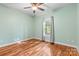Bedroom featuring a hardwood floor, a ceiling fan, and natural light at 1313 Western Hills Ln, Vale, NC 28168