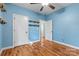 Bedroom with hardwood floors, closet, and a ceiling fan at 1313 Western Hills Ln, Vale, NC 28168