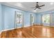 Bright bedroom with hardwood floors, crown molding, three windows, and a ceiling fan at 1313 Western Hills Ln, Vale, NC 28168