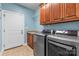 Laundry room with modern washer and dryer, and tiled floor at 1313 Western Hills Ln, Vale, NC 28168