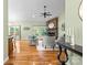 Bright living room features hardwood floors, a stone fireplace, and French doors leading to the outdoors at 1313 Western Hills Ln, Vale, NC 28168