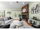 Comfortable living area showcasing a stone fireplace, hardwood floors, and sophisticated seating arrangements at 1313 Western Hills Ln, Vale, NC 28168