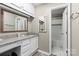 Bathroom with granite countertops, mirror, and view to tub/shower at 1420 11Th Street Nw Dr # 15, Hickory, NC 28601