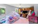 Charming bedroom with built-in shelves, canopy bed, and bright natural light at 1420 11Th Street Nw Dr # 15, Hickory, NC 28601