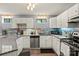 Modern kitchen features stainless steel appliances, granite countertops, and plenty of cabinet space at 1420 11Th Street Nw Dr # 15, Hickory, NC 28601