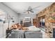 Cozy living room featuring a stone fireplace, comfortable seating, and access to the outdoor patio at 1420 11Th Street Nw Dr # 15, Hickory, NC 28601