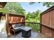 Private patio with an outdoor seating area and wooded views at 1420 11Th Street Nw Dr # 15, Hickory, NC 28601