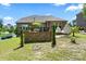 Attractive home exterior featuring a deck, backyard patio, and well-maintained lawn at 16402 Doves Canyon Ln, Charlotte, NC 28278
