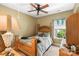 Comfortable bedroom with a wooden bed frame and a window letting in natural light at 16402 Doves Canyon Ln, Charlotte, NC 28278