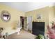 Bright bedroom featuring a large window, bird cage, and an open doorway at 16402 Doves Canyon Ln, Charlotte, NC 28278