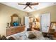 Bedroom with bed, dresser, mirror, and window with lots of natural light at 16402 Doves Canyon Ln, Charlotte, NC 28278