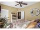 Bedroom with floral bedding and pillows, a dresser, and a decorative mirror at 16402 Doves Canyon Ln, Charlotte, NC 28278
