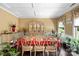 Elegant dining room with beautiful furnishings, hardwood floors, and natural light at 16402 Doves Canyon Ln, Charlotte, NC 28278