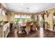 Sun-filled dining area featuring hardwood floors, natural lighting, and space to dine comfortably at 16402 Doves Canyon Ln, Charlotte, NC 28278