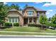 Charming stone home featuring a well-manicured lawn and professional landscaping at 16402 Doves Canyon Ln, Charlotte, NC 28278
