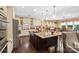 Gourmet kitchen with a large island, granite countertops, and stainless steel appliances at 16402 Doves Canyon Ln, Charlotte, NC 28278