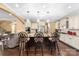 Well-lit kitchen with granite countertops, large island with barstool seating, and stainless steel appliances at 16402 Doves Canyon Ln, Charlotte, NC 28278