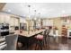Bright kitchen features a center island with granite countertop, pendant lighting, and stainless appliances at 16402 Doves Canyon Ln, Charlotte, NC 28278