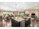 Gourmet kitchen with a large island, granite countertops, and stainless steel appliances at 16402 Doves Canyon Ln, Charlotte, NC 28278