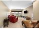 Cozy living room with large windows, comfortable seating, and neutral color palette at 16402 Doves Canyon Ln, Charlotte, NC 28278