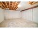 Unfinished basement area with concrete floors, exposed ceiling, and cinder block walls at 165 Fieldstone Farm Dr, Statesville, NC 28625