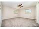Neutral bedroom with two windows offering ample natural light and ceiling fan at 165 Fieldstone Farm Dr, Statesville, NC 28625