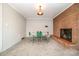 Dining room featuring carpet, fireplace, and a classic table at 165 Fieldstone Farm Dr, Statesville, NC 28625