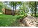 Brick house with mature trees and a long driveway at 165 Fieldstone Farm Dr, Statesville, NC 28625