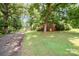 A charming brick house with a long driveway and mature trees at 165 Fieldstone Farm Dr, Statesville, NC 28625