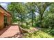 Outdoor patio showcasing space with mature trees offering shade to the house at 165 Fieldstone Farm Dr, Statesville, NC 28625
