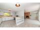 Open kitchen layout with a peninsula, white cabinets, and modern appliances at 165 Fieldstone Farm Dr, Statesville, NC 28625
