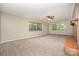 Bright living room with neutral carpet and a brick fireplace at 165 Fieldstone Farm Dr, Statesville, NC 28625