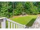 Lush backyard featuring a gazebo, green lawn, and wooded backdrop creating a relaxing outdoor retreat at 1701 Whitney Ln, Salisbury, NC 28146