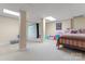 Spacious basement area featuring carpet, large columns, and a built-in projector screen for entertainment at 1701 Whitney Ln, Salisbury, NC 28146