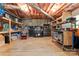 Unfinished basement featuring exposed beams, concrete floor, tool storage, and visible utilities at 1701 Whitney Ln, Salisbury, NC 28146
