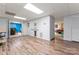 Finished basement with luxury vinyl plank, bar area, and access to other rooms in the house at 1701 Whitney Ln, Salisbury, NC 28146