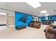 Finished basement with Carolina Panthers theme, bar area, and comfortable seating at 1701 Whitney Ln, Salisbury, NC 28146