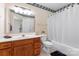 Bathroom with a bathtub and shower combination, a sink vanity, and decorative wallpaper at 1701 Whitney Ln, Salisbury, NC 28146