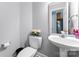 Stylish half bathroom features modern fixtures, a sink, and a toilet at 1701 Whitney Ln, Salisbury, NC 28146