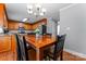 Comfortable dining room with wooden table adjacent to the kitchen at 1701 Whitney Ln, Salisbury, NC 28146