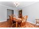 Warm dining area showcasing hardwood floors, a chandelier, and classic wooden furniture at 1701 Whitney Ln, Salisbury, NC 28146