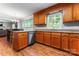 Well-lit kitchen showcasing granite countertops and abundant wooden cabinets at 1701 Whitney Ln, Salisbury, NC 28146